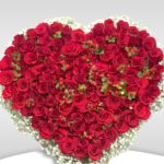 The Heart Shape Of Red Roses With Hypericum Filler With Gypsophila
